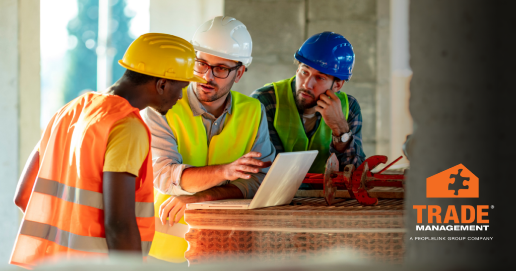 Job-ready skilled trades team engaged in planning meeting.